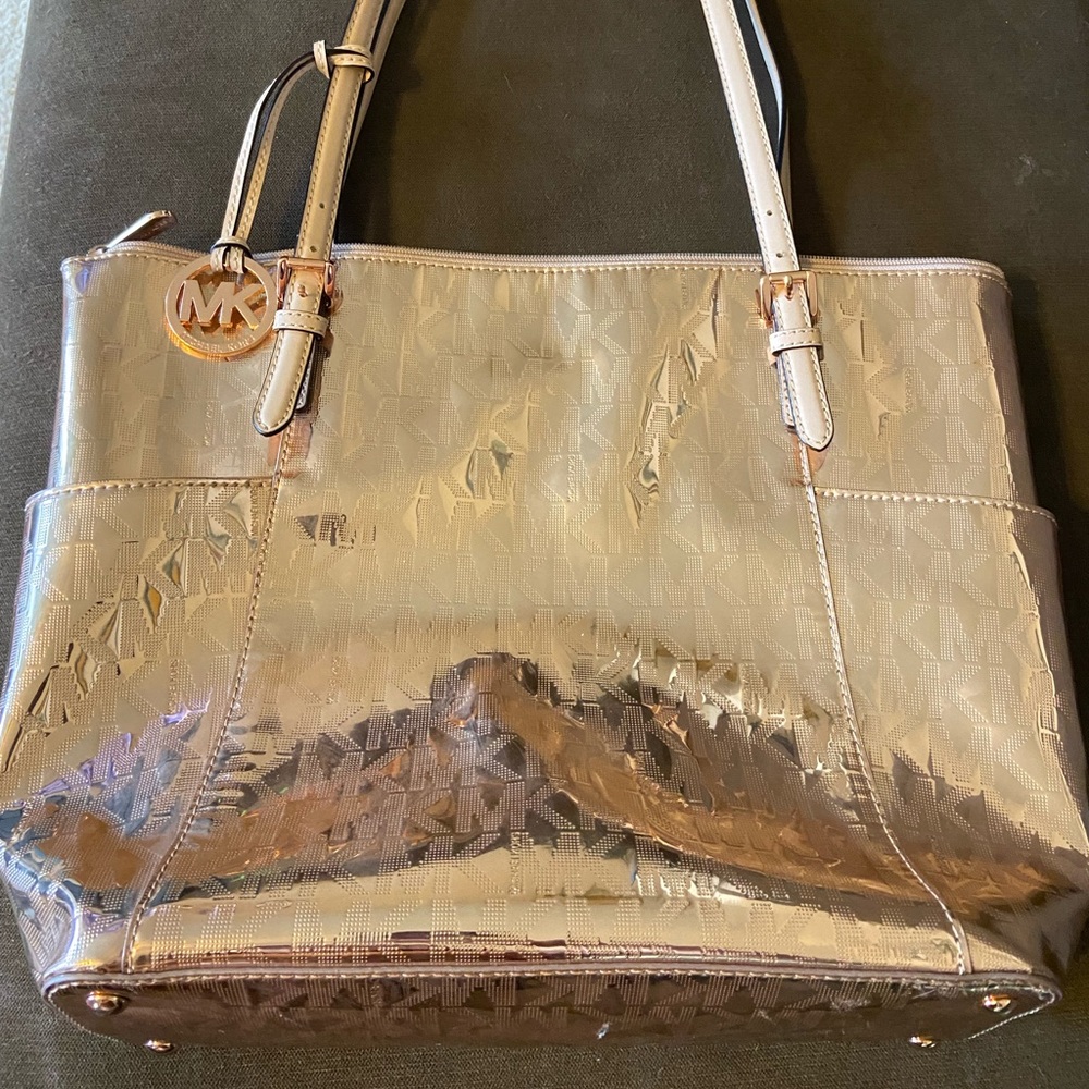 Metallic rose gold Michael Kors bag.